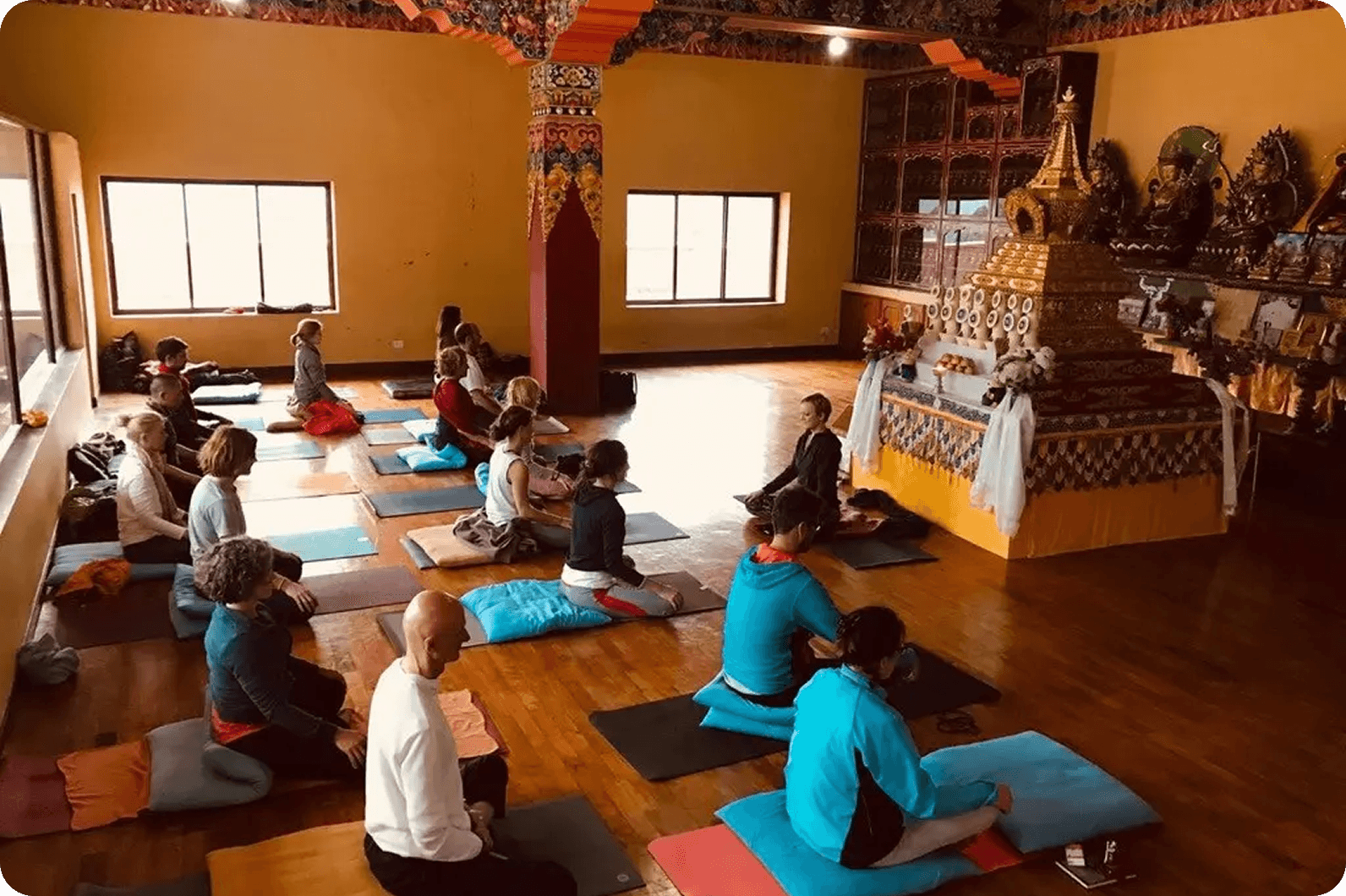 Group meditation in a traditional hall