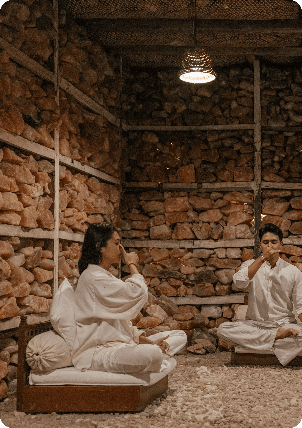 Guests meditating in a Himalayan salt chamber